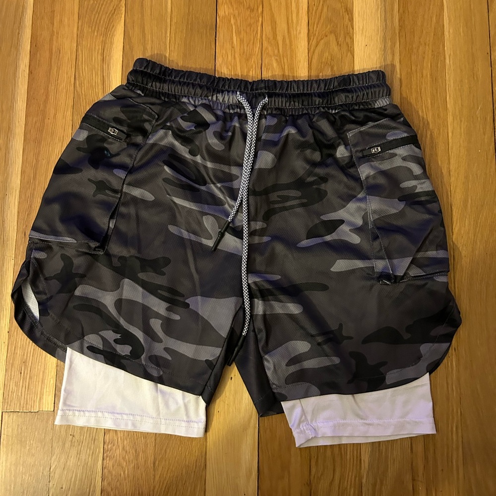 Used Men’s shorts with drawstring, small blue stain on right side front, Size M